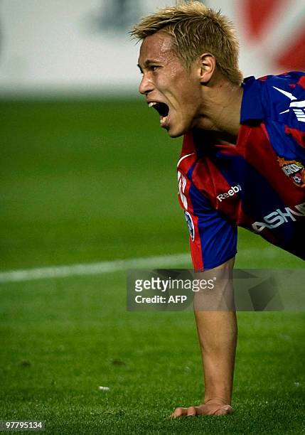 Moscow's Japanesse midfielder Keisuke Honda gestures during a UEFA Champions League football match against Sevilla on March 16, 2010 at Ramon Sanchez...