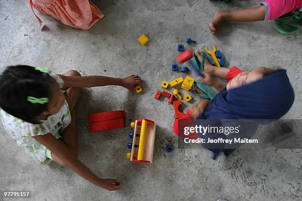 Filipino Muslim kids affected by the fighting between Philippine security forces and Muslim rebels are seen playing after undergoing psychological...