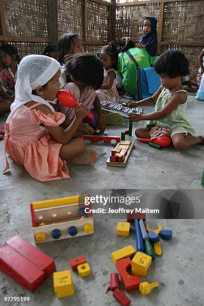 Filipino Muslim kids affected by the fighting between Philippine security forces and Muslim rebels are seen playing after undergoing psychological...