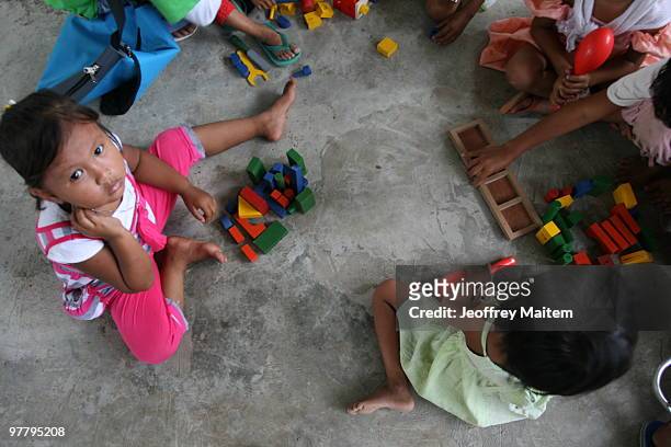 Filipino Muslim kids affected by the fighting between Philippine security forces and Muslim rebels are seen playing after undergoing psychological...
