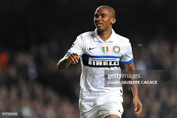 Inter Milan's Cameroonian forward Samuel Eto'o celebrates after scoring during the second leg in the round of 16 UEFA Champions League match at home...