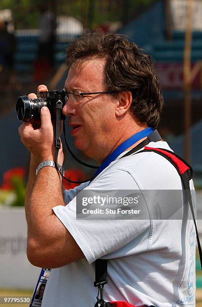 Former England cricketer and Daily Telegraph journalist Derek Pringle takes a picture after day five of the 1st Test match between Bangladesh and...