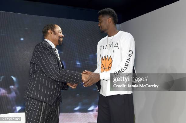 Walt "Clyde" Frazier and Deandre Ayton attend the PUMA Hoops HQ kickoff where Walt "Clyde" Frazier signs the first ever life long contract with PUMA...