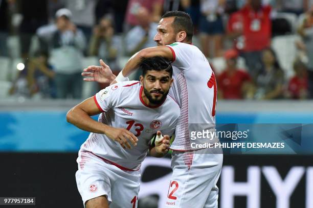 Tunisia's defender Ali Maaloul congratulates Tunisia's midfielder Ferjani Sassi for his goal during the Russia 2018 World Cup Group G football match...