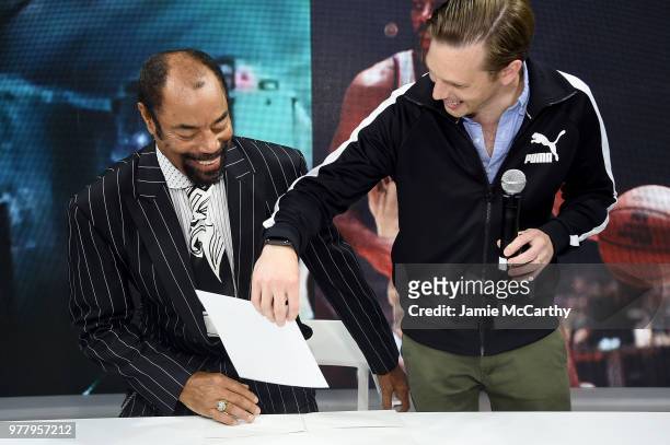Walt "Clyde" Frazier and PUMA global director of brand and marketing Adam Petrick attend the PUMA Hoops HQ kickoff where Walt "Clyde" Frazier signs...