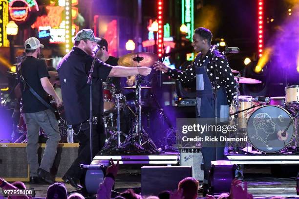 Luke Combs and Leon Bridges perform at CMT Crossroads at The Stage On Broadway on June 5, 2018 in Nashville, Tennessee.