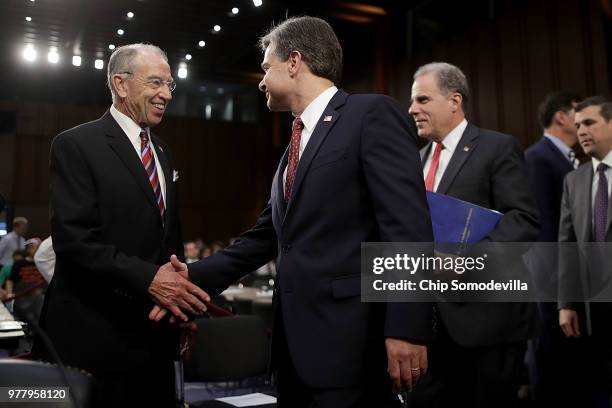 Senate Judiciary Committee Chairman Charles Grassley greets Federal Bureau of Investigation Director Christopher Wray and Justice Department...