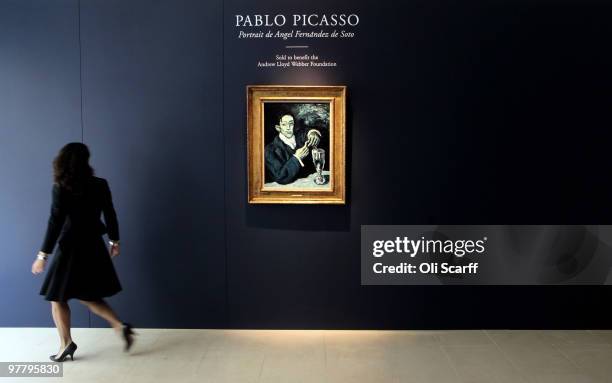 Giovanna Bertazzoni, the Head of Impressionist and Modern Art Department for Christie's, walks past a 1903 painting by Pablo Picasso entitled...