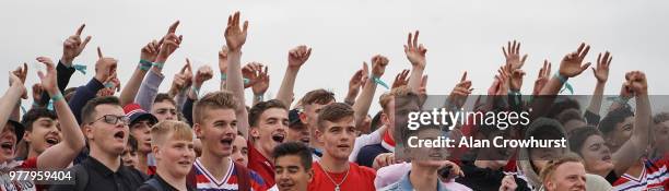 Football fans show excitement as England go close to scoring as they watch the match inside the Lunar Beach Cinema on Brighton beach as England play...