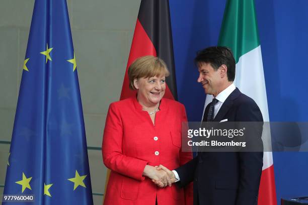 Angela Merkel, Germany's chancellor, left, shakes hands with Giuseppe Conte, Italy's prime minister, at the Chancellery building in Berlin, Germany,...