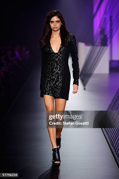 Model Samantha Harris showcases designs on the catwalk by Manning Cartell as part of L'Oreal Paris Runway 4 on the third day of the 2010 L'Oreal...