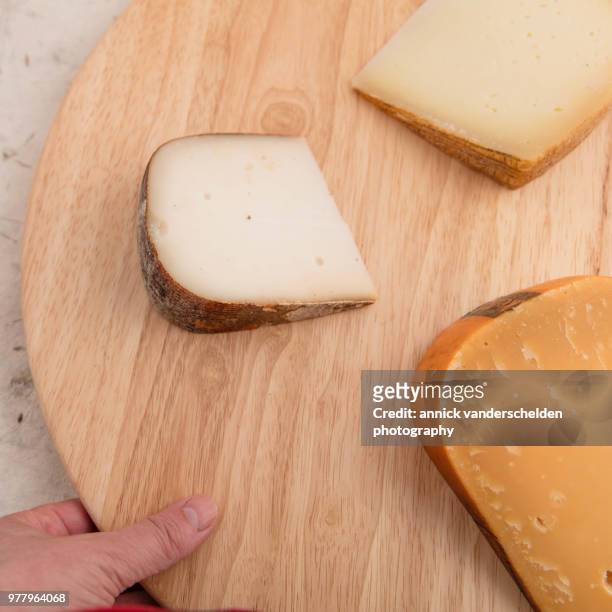 gouda cheese, tomme de chèvre and  pecorino romano. - gouda stock pictures, royalty-free photos & images