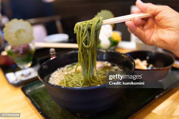 eating green tea soba - uji kyoto stock pictures, royalty-free photos & images