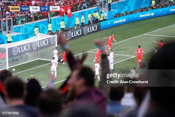 Fans celebrate as Harry Kane scores for England as they play Tunisia in the group stages of the 2018 FIFA World Cup tournament on June 18, 2018 in...