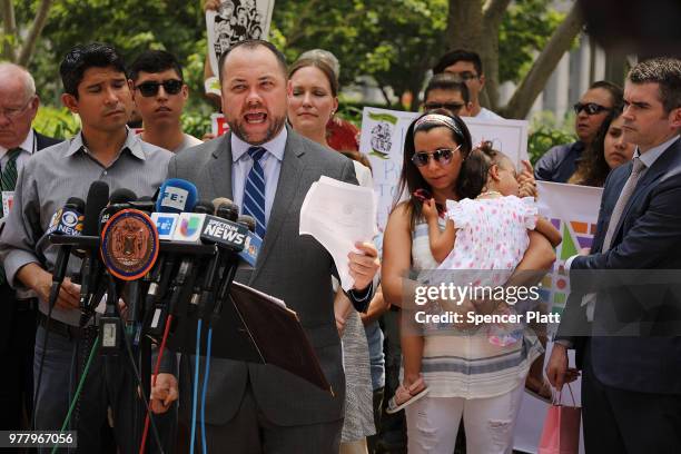 City Council Speaker Corey Johnson speaks at a news conference with Sandra Chica, the wife of an immigrant deliveryman who was detained by...