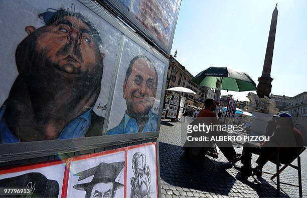 Caricatures are exhibited at Piazza Navona on March 17, 2010 in Rome. AFP PHOTO / ALBERTO PIZZOLI