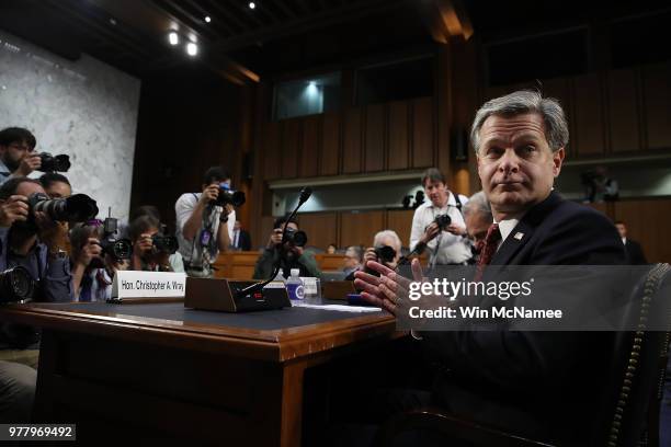 Federal Bureau of Investigation Director Christopher Wray looks toward his staff an prior to testifimony before the Senate Judiciary Committee on...