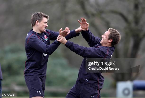 Jonny Wilkinson playfully fights with team mate Tobby Flood in a warm up session during the England training session held at Pennyhill Park on March...