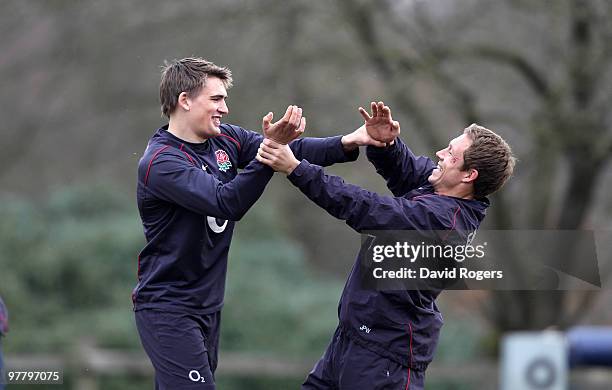 Jonny Wilkinson playfully fights with team mate Tobby Flood in a warm up session during the England training session held at Pennyhill Park on March...