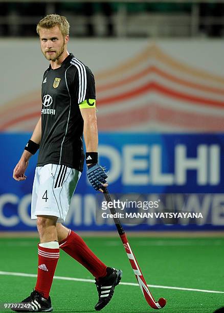German hockey captain Maximilian Muller walks back dejected after losing the World Cup 2010 Final match against Australia at the Major Dhyan Chand...