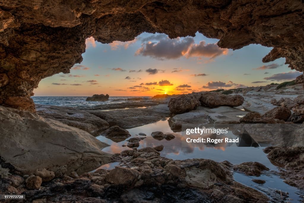 Cave on seashore at sunset, Cyprus