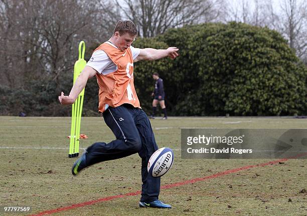 Chris Ashton kicks the ball upfield during the England training session held at Pennyhill Park on March 17, 2010 in Bagshot, England.