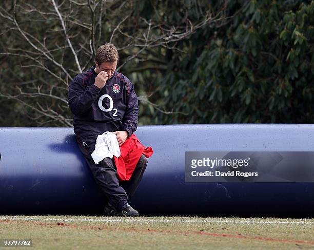 Jonny Wilkinson looks dejected as he sits during the England training session held at Pennyhill Park on March 17, 2010 in Bagshot, England.