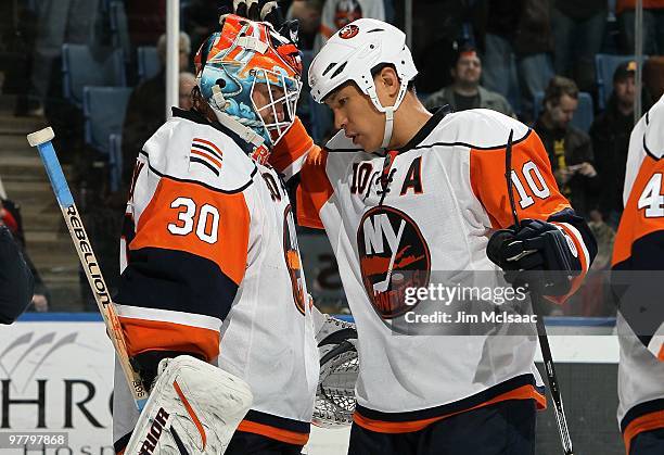 Dwayne Roloson and Richard Park of the New York Islanders celebrate against the Chicago Blackhawks on March 2, 2010 at Nassau Coliseum in Uniondale,...