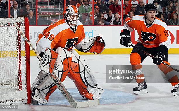 Michael Leighton and Matt Carle of the Philadelphia Flyers skate against the Toronto Maple Leafs on March 7, 2010 at Wachovia Center in Philadelphia,...