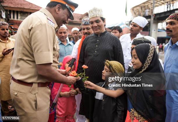 People offer namaz out side the Bandra station on the occasion of Eid-al-Fit on June 16, 2018 in Mumbai, India. The auspicious occasion of...