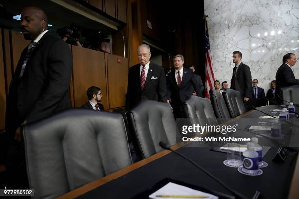 Senate Judiciary Committee Chairman Chuck Grassley leads Federal Bureau of Investigation Director Christopher Wray to the witness chair prior to Wray...