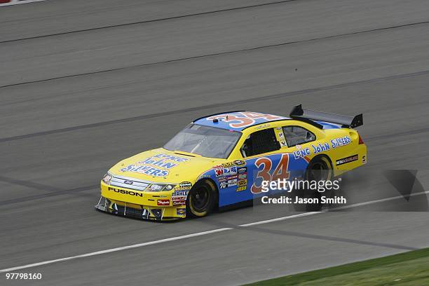 Travis Kvapil, driver of the Long John Silver's Ford, drives during practice for the NASCAR Sprint Cup Series Auto Club 500 at Auto Club Speedway on...