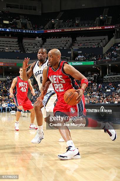 Jarvis Hayes of the New Jersey Nets drives against Sam Young of the Memphis Grizzlies during the game on March 8, 2010 at FedExForum in Memphis,...