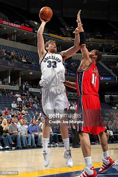 Marc Gasol of the Memphis Grizzlies puts up a shot against Brook Lopez of the New Jersey Nets during the game on March 8, 2010 at FedExForum in...