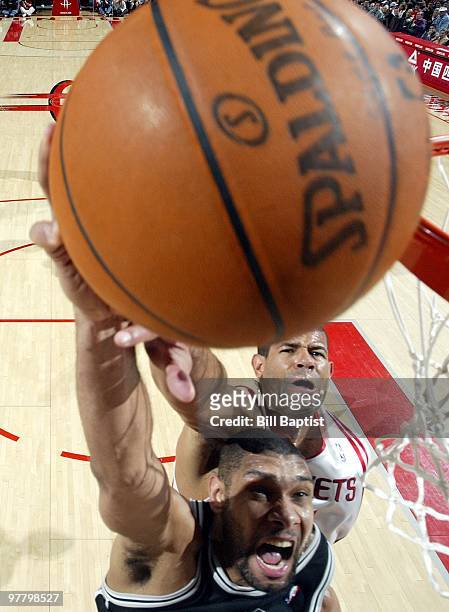 Tim Duncan of the San Antonio Spurs shoots a layup against Shane Battier of the Houston Rockets during the game at Toyota Center on February 26, 2010...