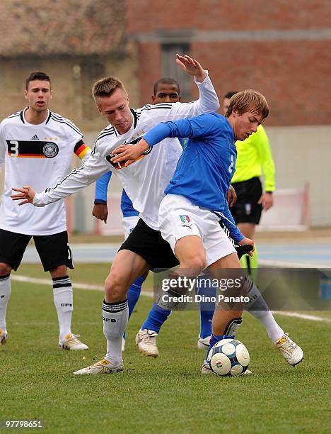 Alessandro Crescenzi of Italy battles for the ball with Marco Stiepermann of Germany during the U19 International Friendly match between Italy and...