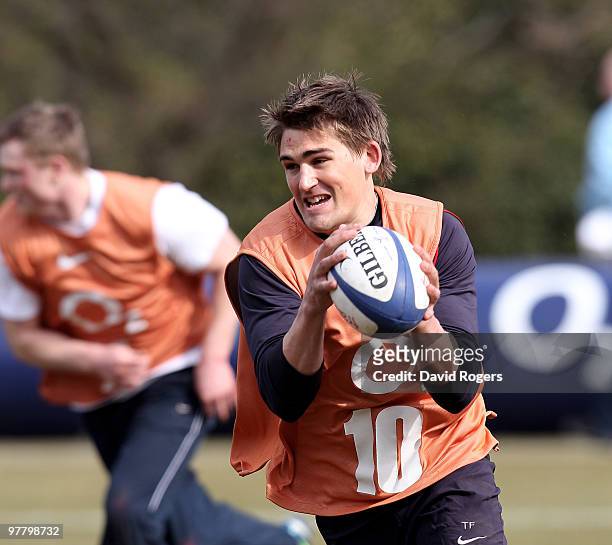 Toby Flood runs with the ball during the England training session held at Pennyhill Park on March 17, 2010 in Bagshot, England.