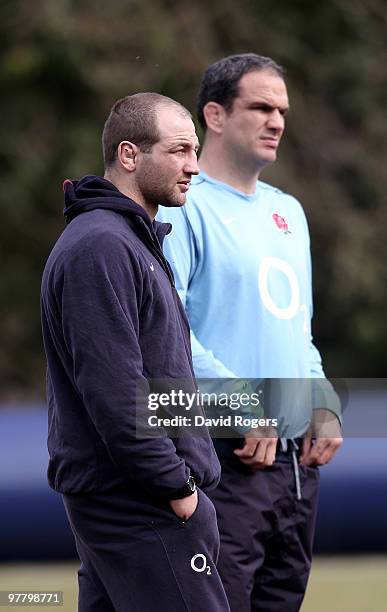 Steve Borthwick, the injured England captain looks concerned as team manager Martin Johnson looks on during the England training session held at...