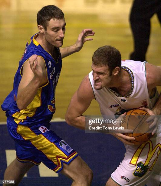 David Pennisi for Townsville struggles past David Stiff for Adelaide in the match between the Adelaide 36ers and the Townsville Crocodiles played at...