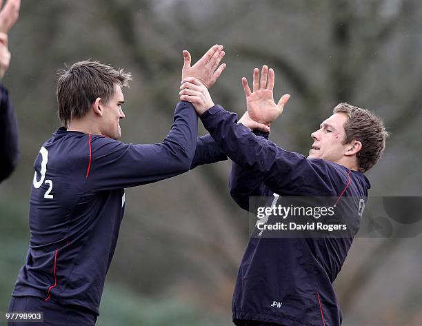 Jonny Wilkinson playfully fights with team mate Tobby Flood in a warm up session during the England training session held at Pennyhill Park on March...