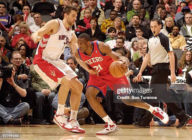 Thaddeus Young of the Philadelphia 76ers drives against Andrea Bargnani of the Toronto Raptors during the game on March 7, 2010 at Air Canada Centre...