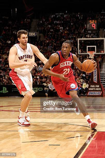 Thaddeus Young of the Philadelphia 76ers drives against Andrea Bargnani of the Toronto Raptors during the game on March 7, 2010 at Air Canada Centre...