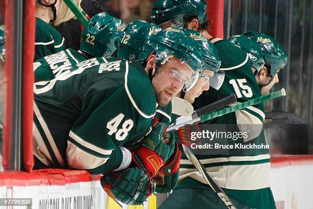 Guillaume Latendresse of the Minnesota Wild watches from the bench against the St. Louis Blues during the game at the Xcel Energy Center on March 14,...