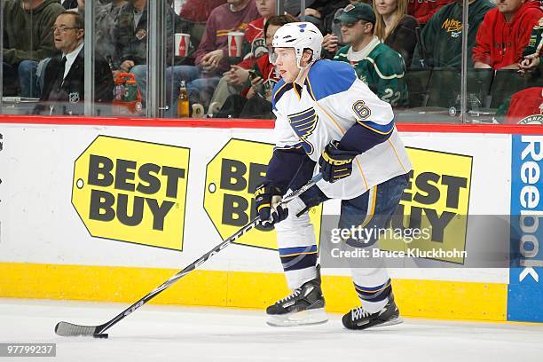 Erik Johnson of the St. Louis Blues skates with the puck against the Minnesota Wild during the game at the Xcel Energy Center on March 14, 2010 in...