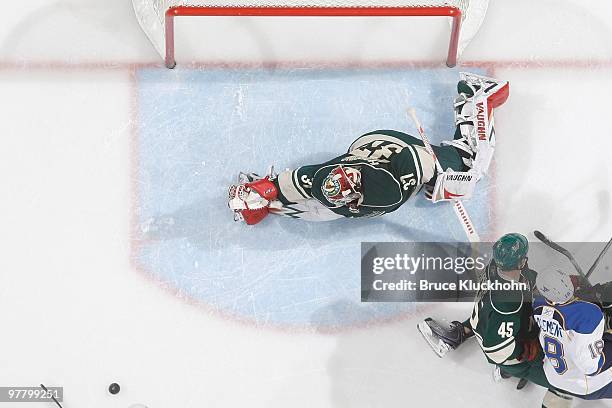 Josh Harding of the Minnesota Wild makes a save against the St. Louis Blues during the game at the Xcel Energy Center on March 14, 2010 in Saint...