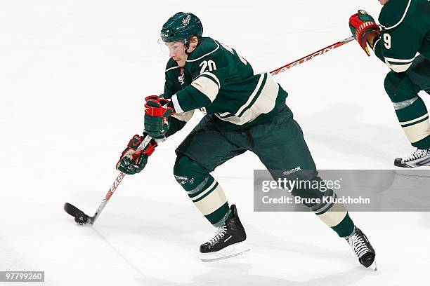 Antti Miettinen of the Minnesota Wild skates with the puck against the Florida Panthers during the game at the Xcel Energy Center on March 9, 2010 in...