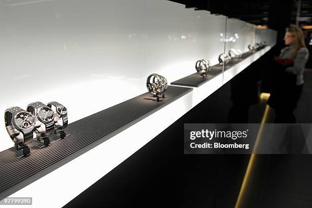 Visitor looks at watches at the Rado stand at the Baselworld watch fair in Basel, Switzerland, on Wednesday, March 17, 2010. The Baselworld Watch...