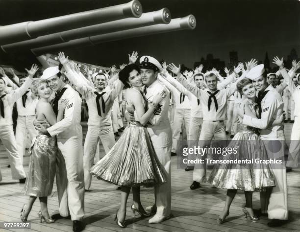 Publicity still of American actors, foreground from left, Jane Powell & Vic Damone, Ann Miller & Tony Martin, and Debbie Reynolds & Russ Tamblyn,...