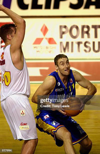 David David Stiff for Adelaide evades David Hinton for Townsville in the match between the Adelaide 36ers and the Townsville Crocodiles played at the...