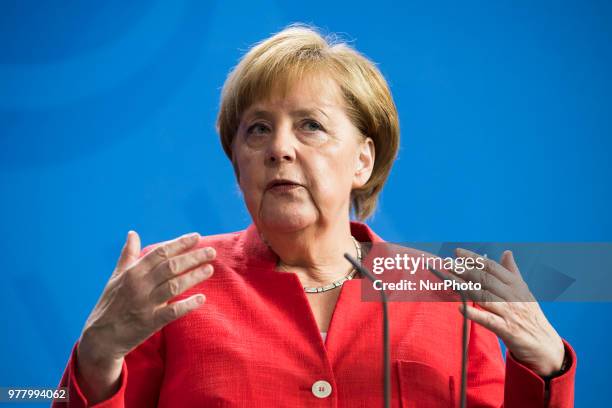 German Chancellor Angela Merkel is pictured as she gives a statement to the press before her meeting at the Chancellery with Italian Prime Minister...